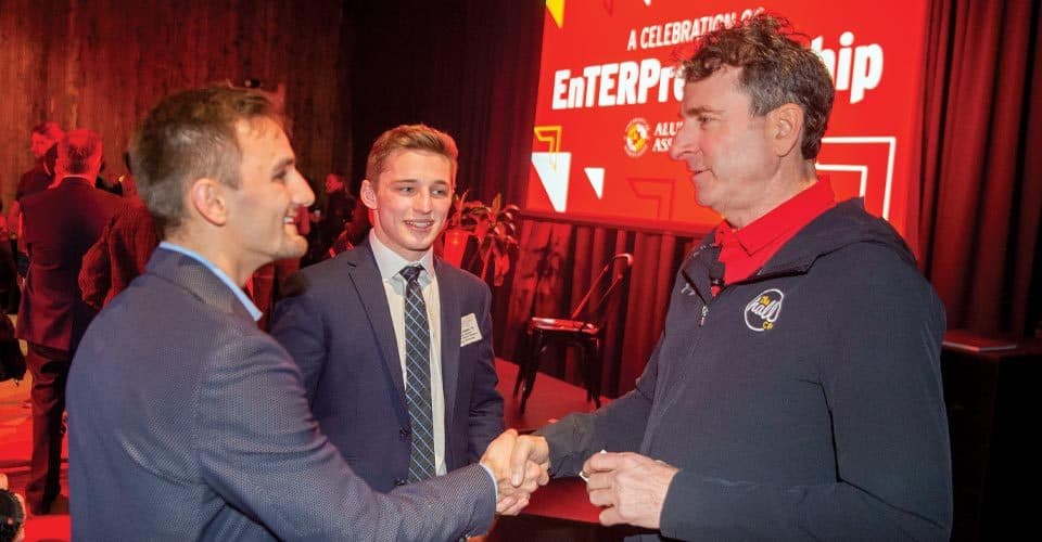 Kevin Plank shakes hands at Alumni Association’s Celebration of EnTERPreneurship event