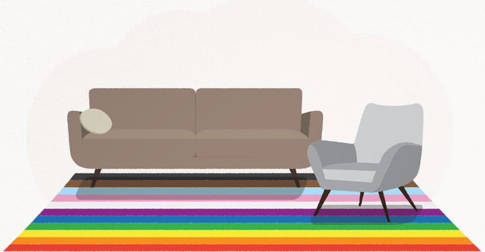 couch and chair with rainbow rug