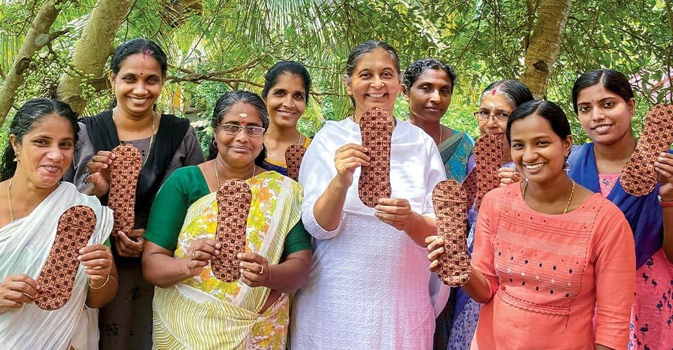 Anju Bist MBA ’98 and group show banana fiber sanitary pads
