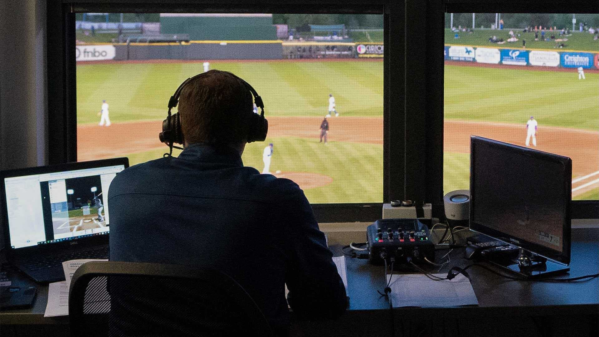 Jake Eisenberg in the broadcast booth at baseball game