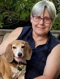 Susan J. Loftus headshot with dog