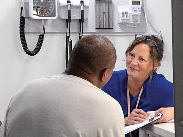 nurse talks to patient