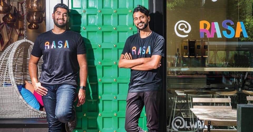 Sahil Rahman ’12 and Rahul Vinod ’11 pose outside Rasa restaurant